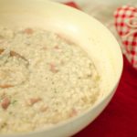 Risotto con crudo di Norcia, certosa e salsa tartufata