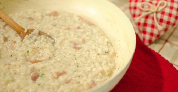 Risotto con crudo di Norcia, certosa e salsa tartufata